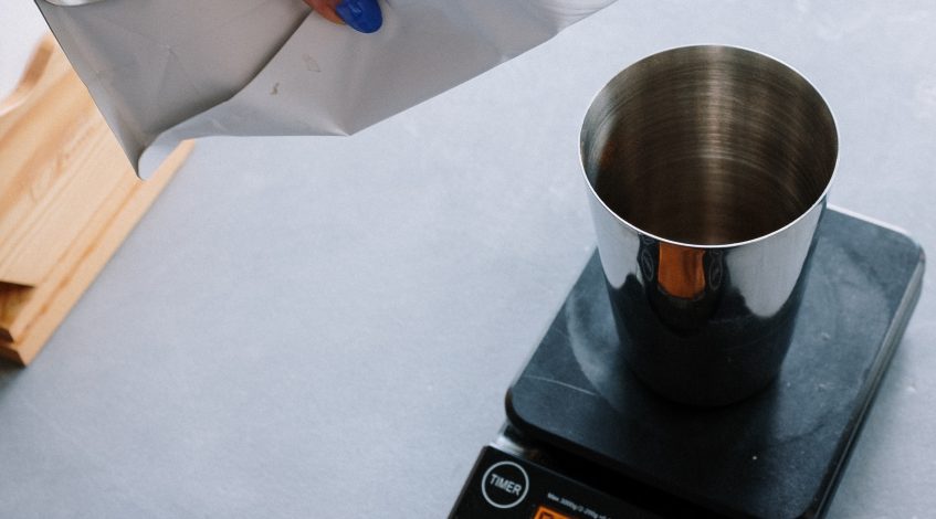 Image of coffee being weighed.